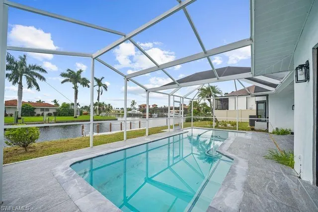 a view of a swimming pool with a patio