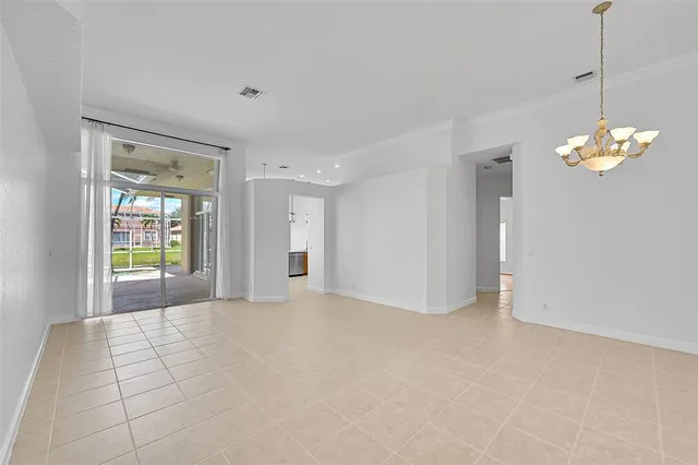 a view of an empty room and a window