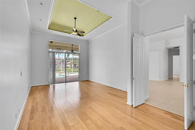 a spacious bathroom with a granite countertop sink a toilet and a window