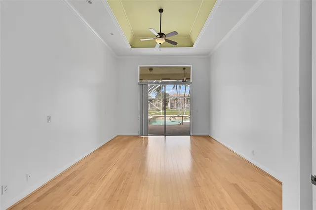 a spacious bathroom with double vanity a mirror a window and a bathtub