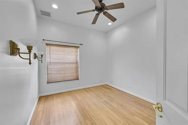 a bathroom with a double vanity sink a toilet and a mirror