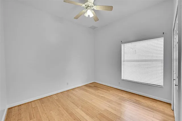 a view of a lake with houses in the back