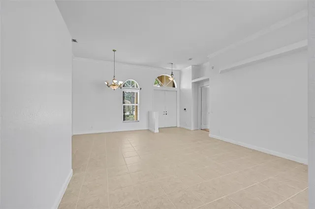 a bedroom with a bed and a potted plant