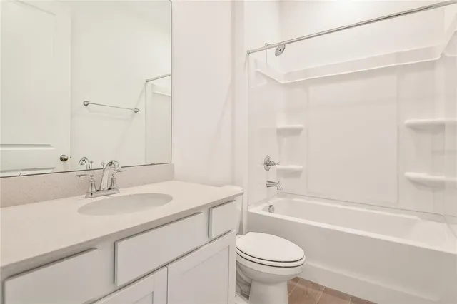 a bathroom with a sink a toilet and a bathtub