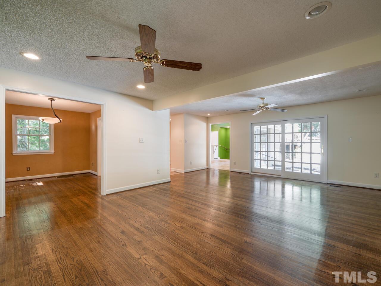 115 Old Oxford Road Chapel Hill, NC 27514 - Photo 15 of 54 a view of an empty room with wooden floor and a window