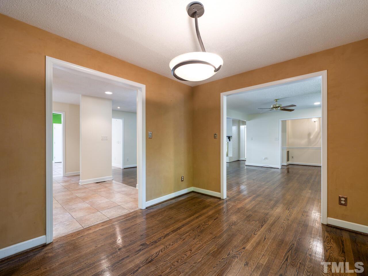 115 Old Oxford Road Chapel Hill, NC 27514 - Photo 20 of 54 a view of a room with wooden floor and large window