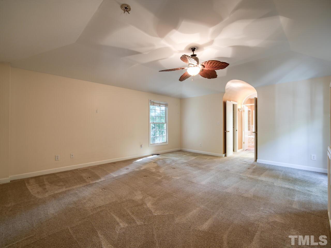 115 Old Oxford Road Chapel Hill, NC 27514 - Photo 24 of 54 a view of a room with a chandelier fan and windows