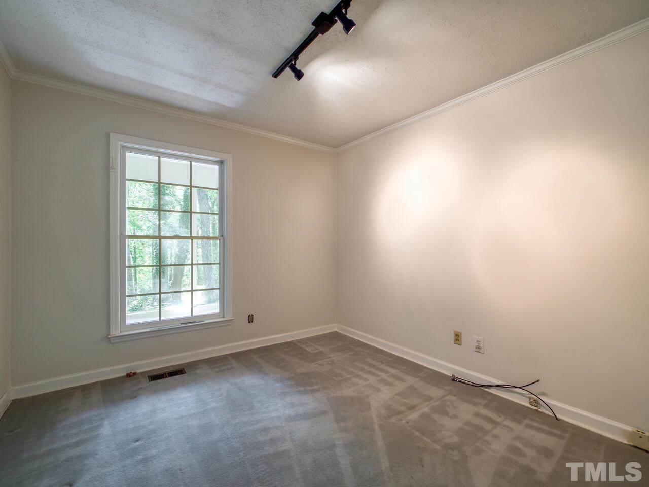 115 Old Oxford Road Chapel Hill, NC 27514 - Photo 36 of 54 an empty room with a window