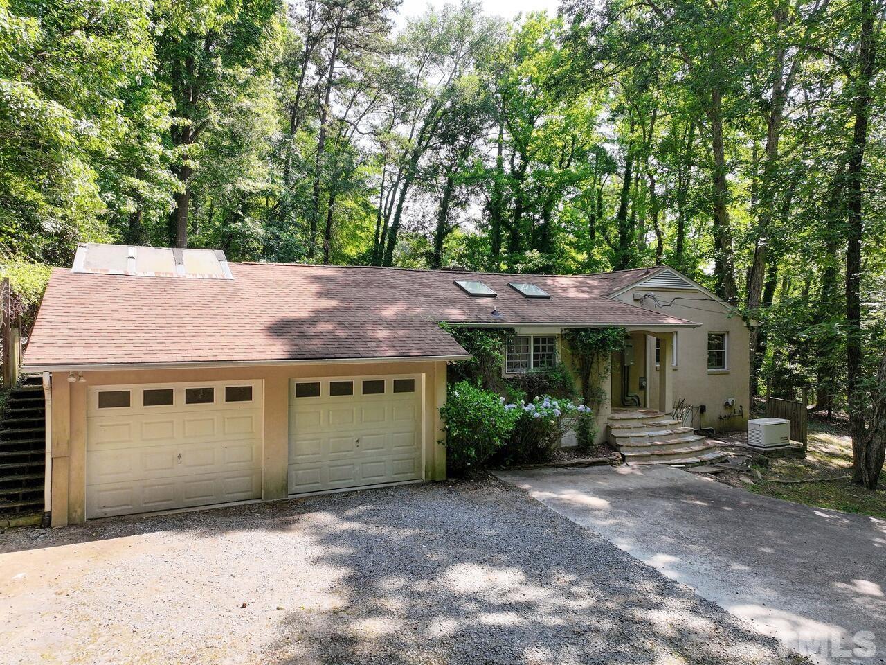 115 Old Oxford Road Chapel Hill, NC 27514 - Photo 47 of 54 a front view of a house with a garden