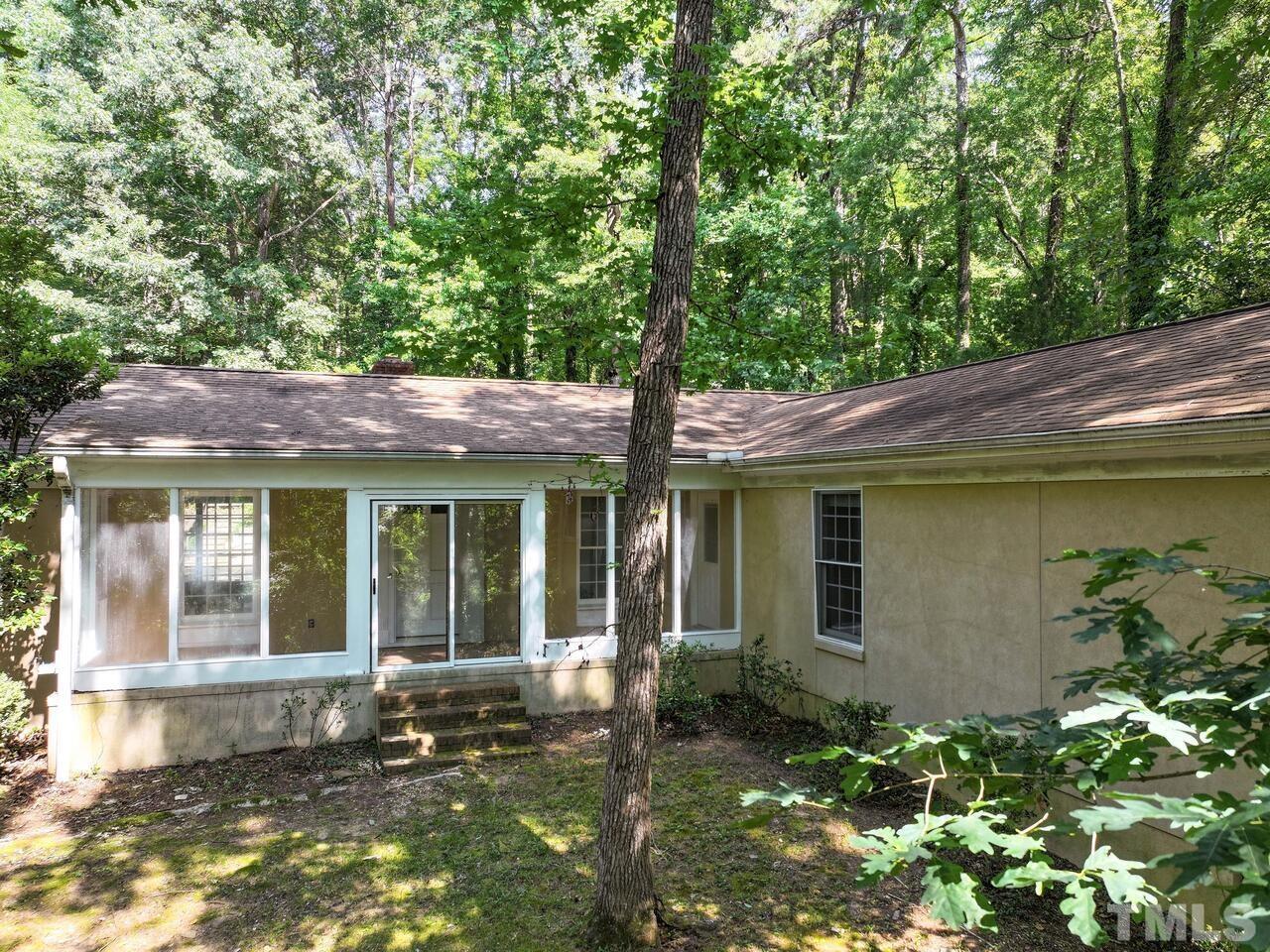 115 Old Oxford Road Chapel Hill, NC 27514 - Photo 50 of 54 front view of a house with a yard