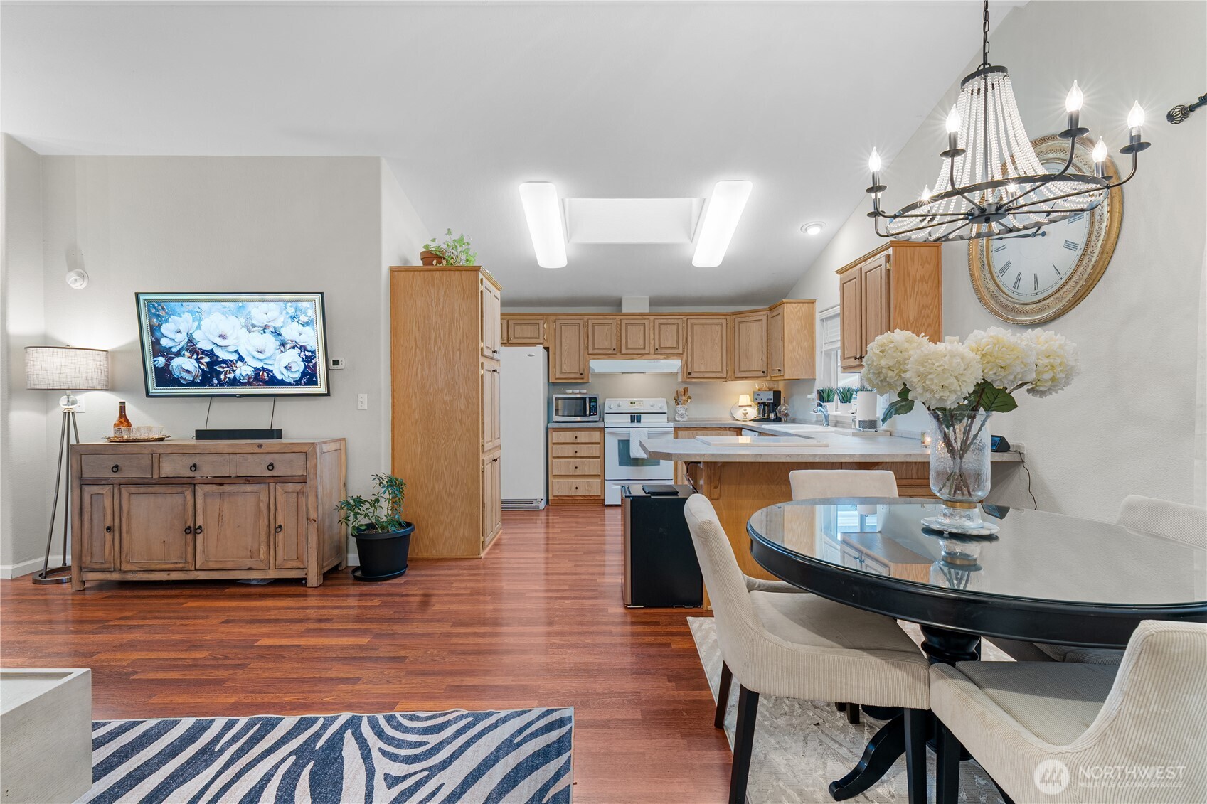 23825 15th Avenue Southeast, Unit 40 Bothell, WA 98021 - Photo 8 of 39 a dining room filled chandelier and wooden floor