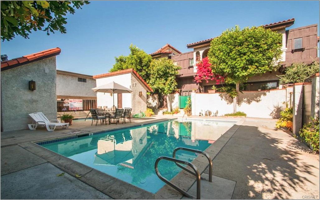17824 Killion Street Encino, CA 91316 - Photo 25 of 25 a view of a swimming pool with a patio