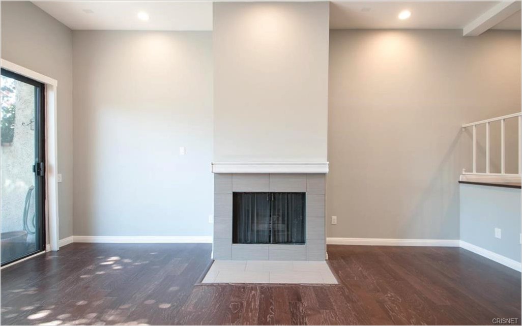 17824 Killion Street Encino, CA 91316 - Photo 3 of 25 a view of an empty room with window and fire place
