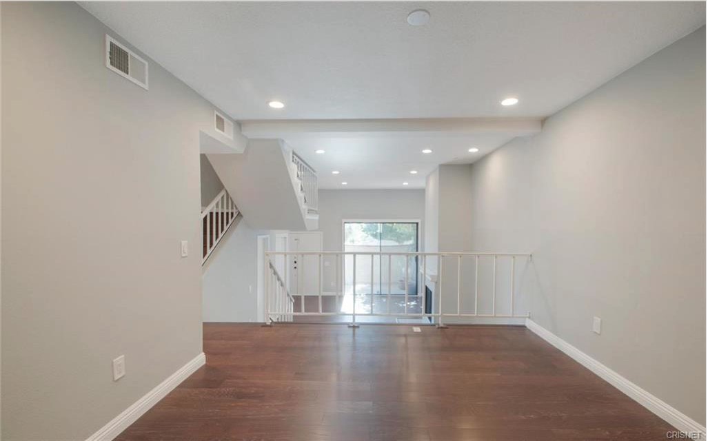 17824 Killion Street Encino, CA 91316 - Photo 5 of 25 a view of empty room with wooden floor