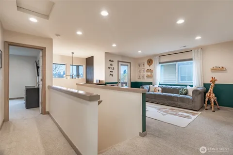 a large living room with stainless steel appliances granite countertop a couch and a view of living room