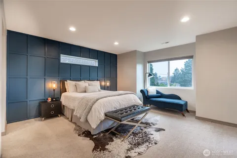 a bed room with a bed and a couch