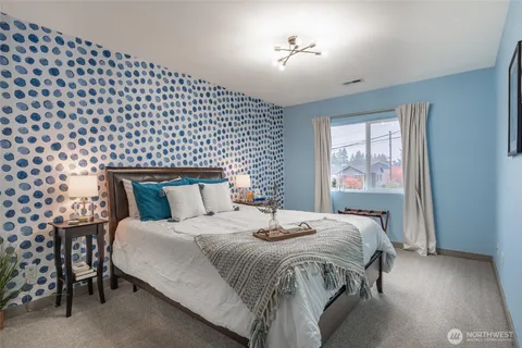 a bedroom with a bed and a table