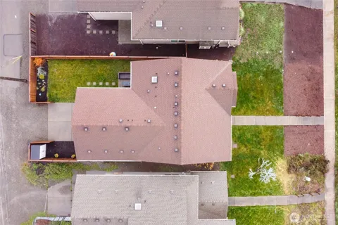 an aerial view of house with yard