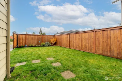 a backyard of a house with lots of green space