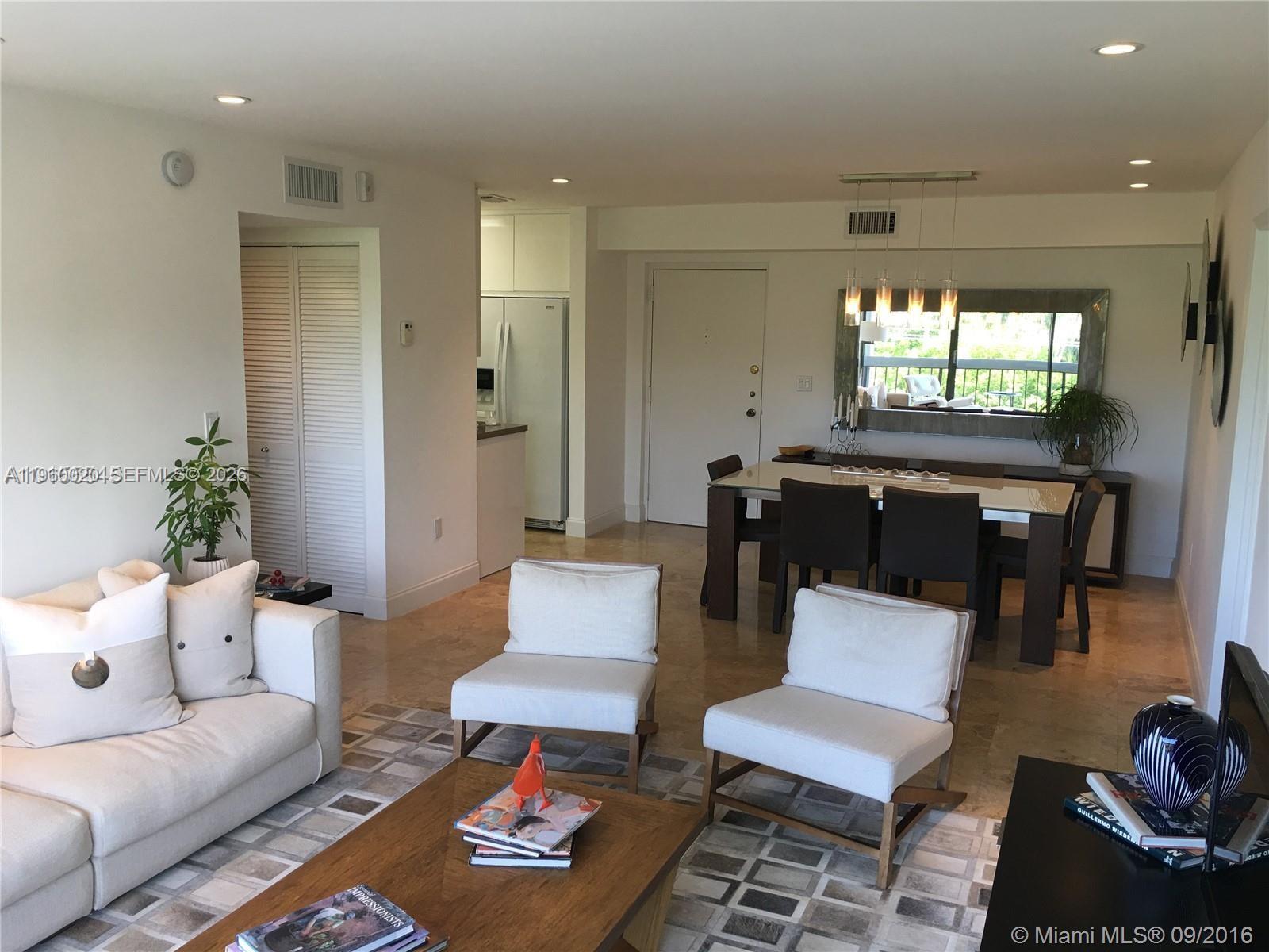 255 Galen Drive, Unit 4A Key Biscayne, FL 33149 - Photo 14 of 37 Great Room - reverse view with furniture