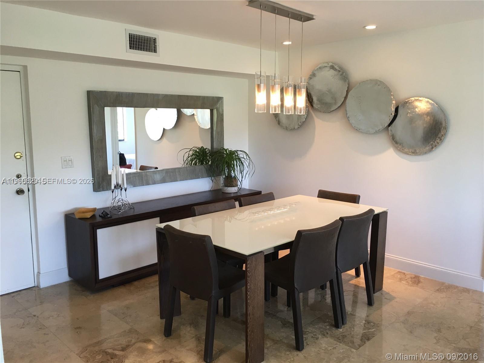255 Galen Drive, Unit 4A Key Biscayne, FL 33149 - Photo 16 of 37 Dining area with furniture