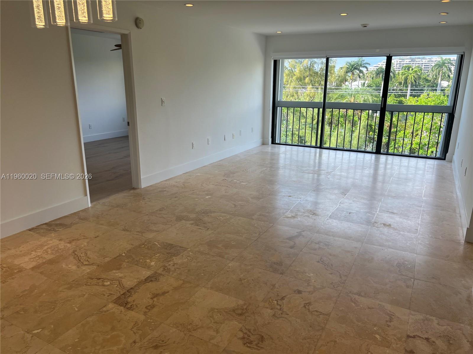 255 Galen Drive, Unit 4A Key Biscayne, FL 33149 - Photo 2 of 37 Great Room - Polished travertine Marble in social areas