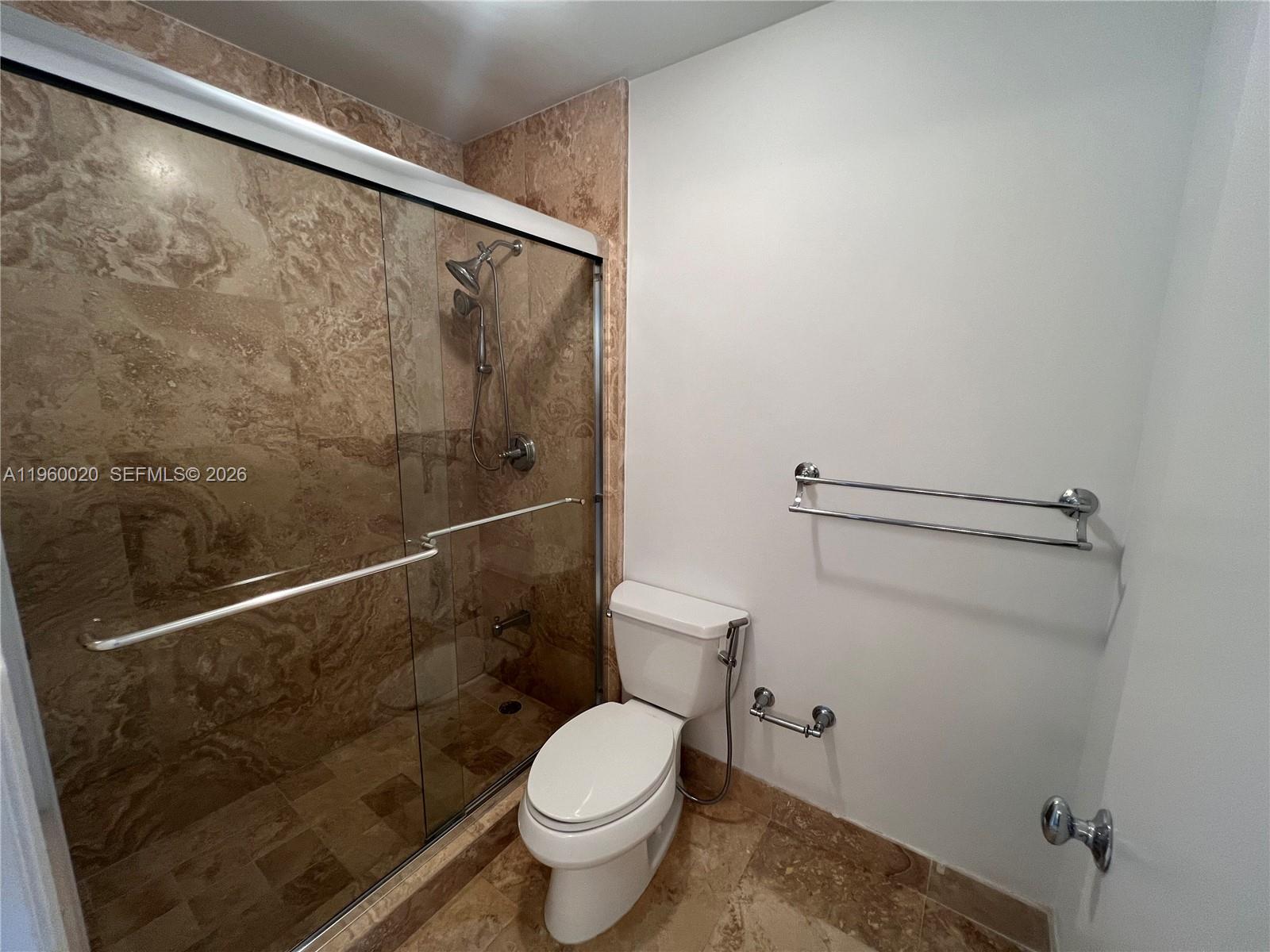 255 Galen Drive, Unit 4A Key Biscayne, FL 33149 - Photo 22 of 37 Travertine marble shower