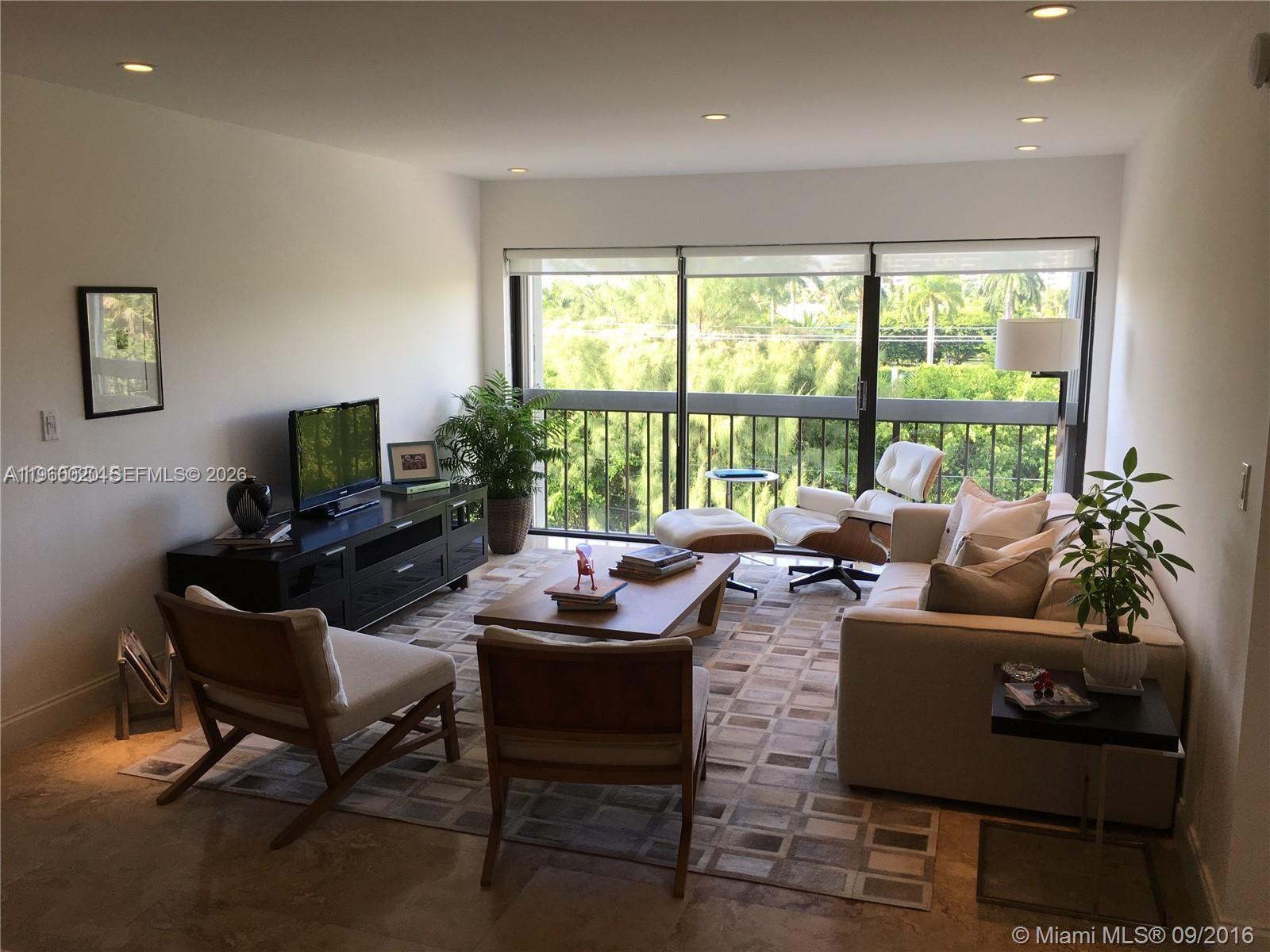 255 Galen Drive, Unit 4A Key Biscayne, FL 33149 - Photo 3 of 37 Great Room - Living room area with furniture