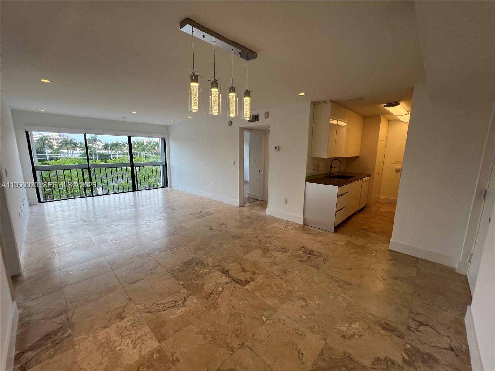 255 Galen Drive, Unit 4A Key Biscayne, FL 33149 - Photo 4 of 37 Great room with the kitchen