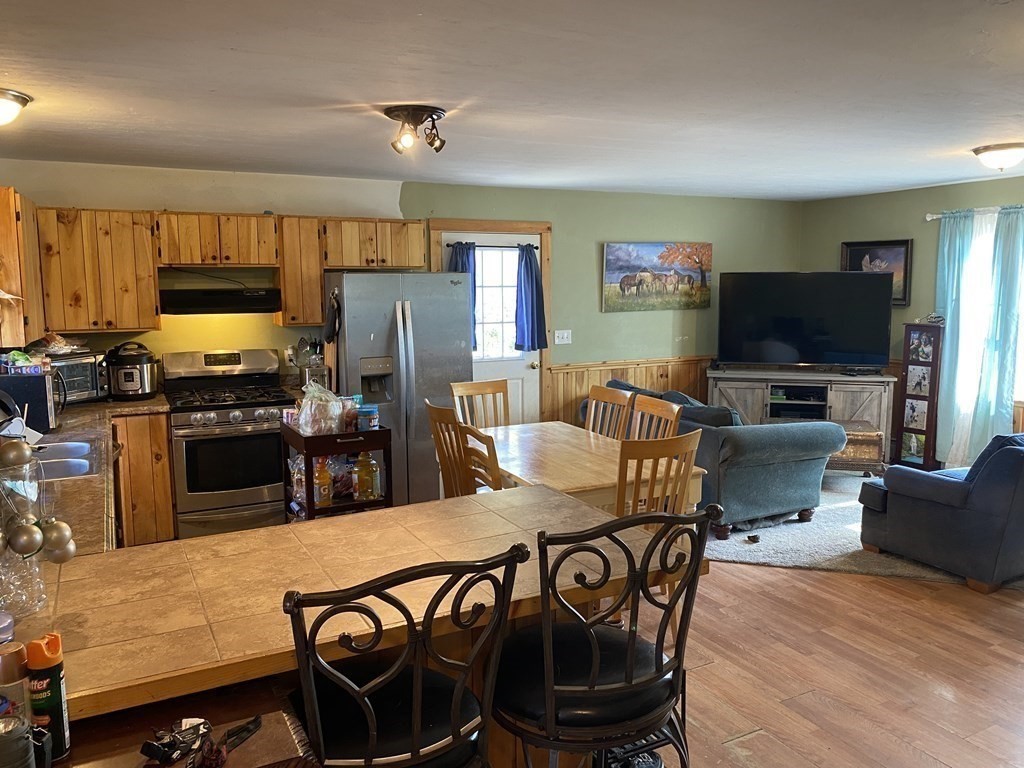 797 Carpenter Road Athol, MA 01331 - Photo 3 of 33 a living room with furniture and a flat screen tv
