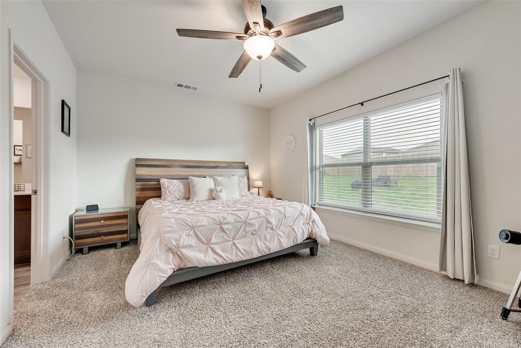 159 Bush Drive Venus, TX 76084 - Photo 13 of 24 a bedroom with a bed and a large window