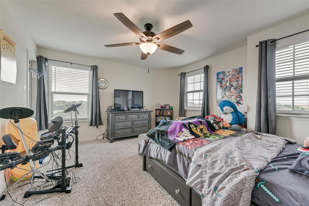 159 Bush Drive Venus, TX 76084 - Photo 18 of 24 a bedroom with a bed and furniture with window