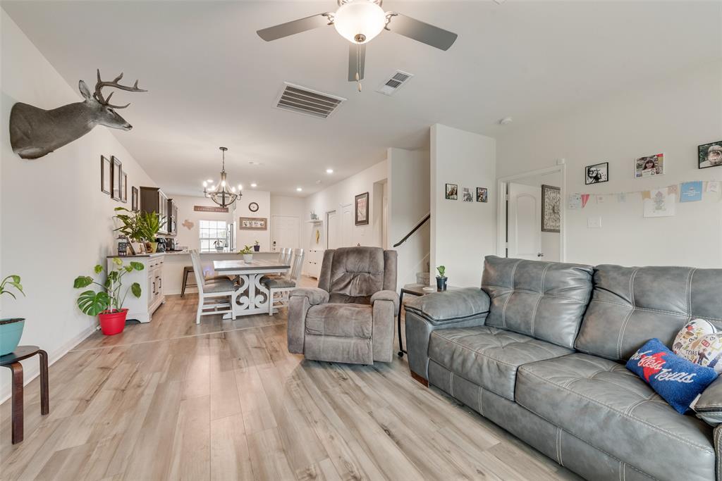 159 Bush Drive Venus, TX 76084 - Photo 6 of 24 a living room with furniture kitchen view and a chandelier