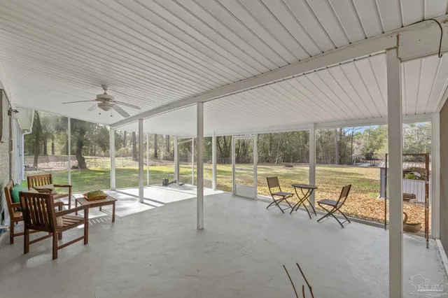 an aerial view of a house with a lake view