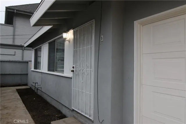 a view of a door and a window in an empty room