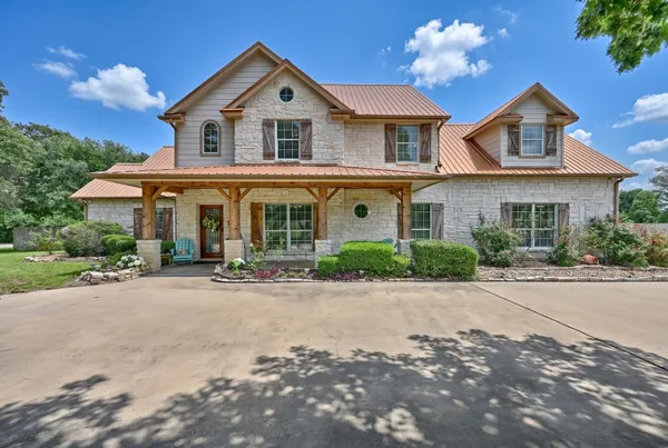 front view of a house with a yard