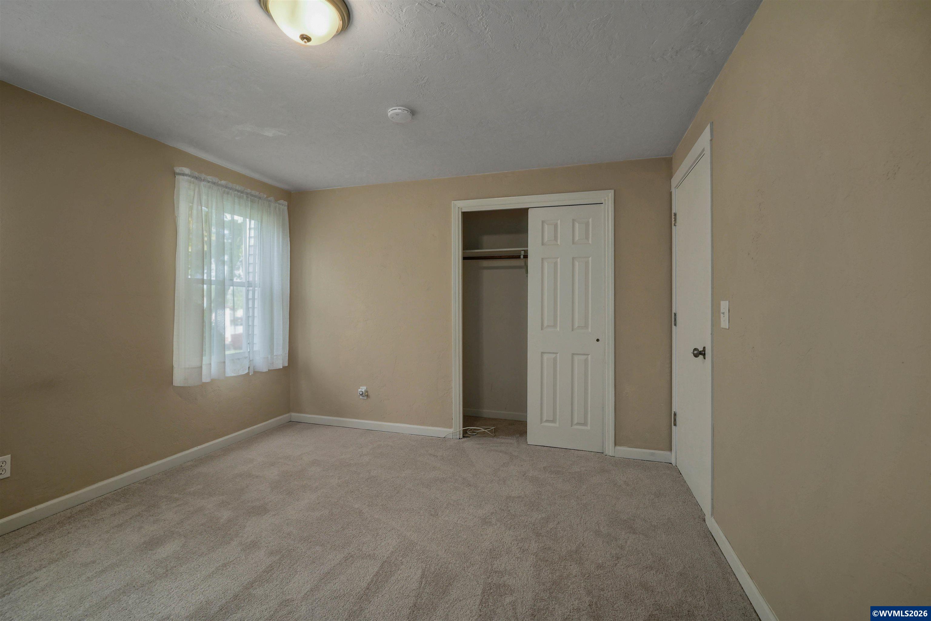 220 Northwest Downy Drive Sublimity, OR 97385 - Photo 24 of 47 a view of an empty room with a window