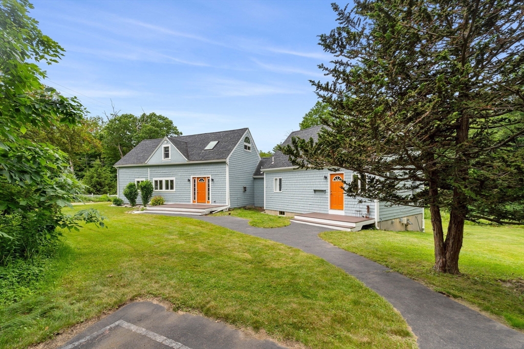 94 Kimball Road Amesbury, MA 01913 - Photo 3 of 37 a front view of a house with yard and green space