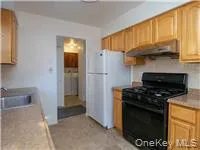 a kitchen with stainless steel appliances granite countertop a stove and a refrigerator