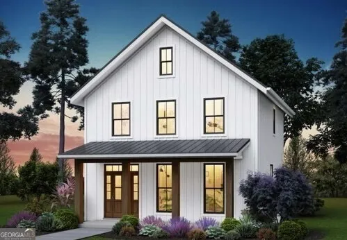 a view of a house with yard and plants