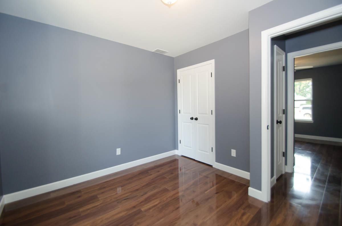 12 East Emory Road Memphis, TN 38109 - Photo 12 of 19 a view of an empty room with wooden floor and a closet