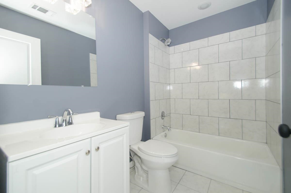 12 East Emory Road Memphis, TN 38109 - Photo 14 of 19 a bathroom with a sink a toilet and shower
