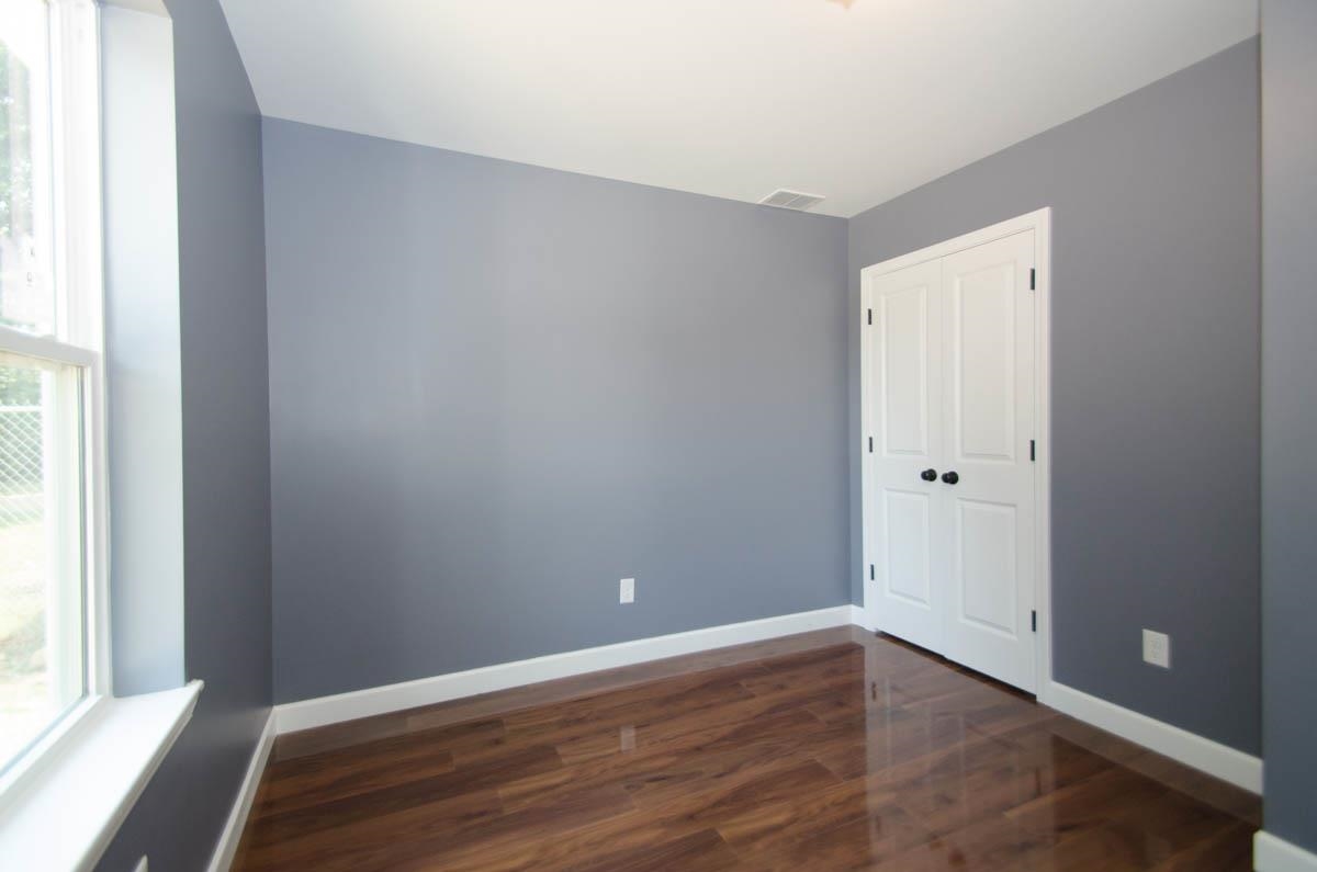 12 East Emory Road Memphis, TN 38109 - Photo 15 of 19 a view of an empty room with wooden floor and a window