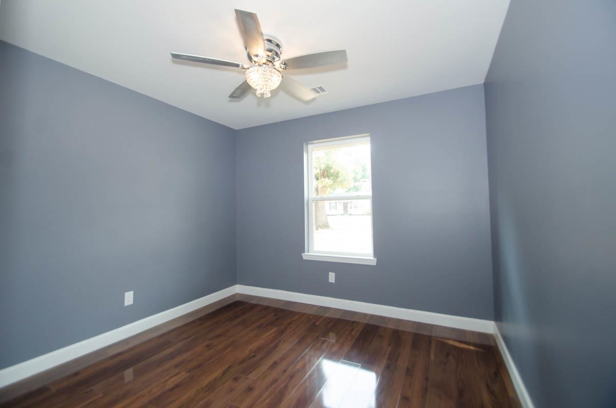 12 East Emory Road Memphis, TN 38109 - Photo 16 of 19 an empty room with wooden floor and windows