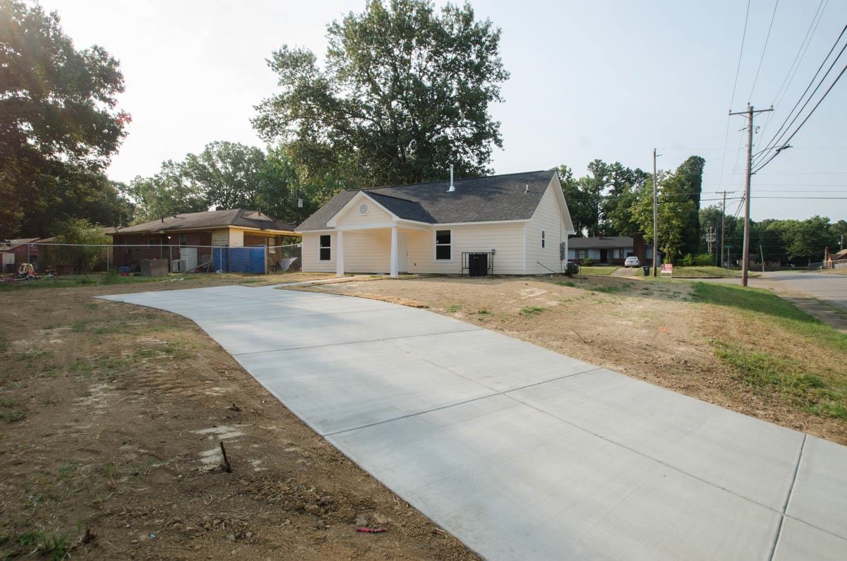 12 East Emory Road Memphis, TN 38109 - Photo 17 of 19 a front view of a house with a yard and trees