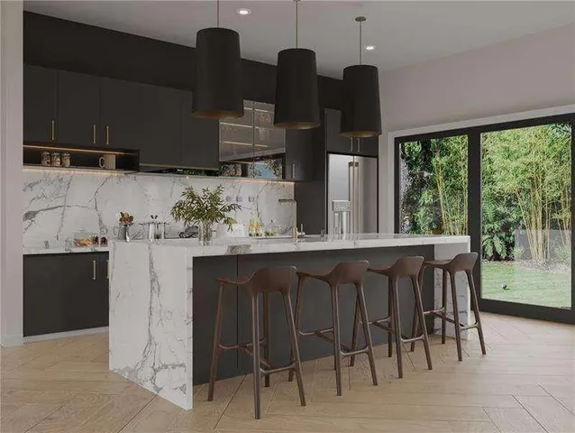 a kitchen with a table chairs sink and cabinets
