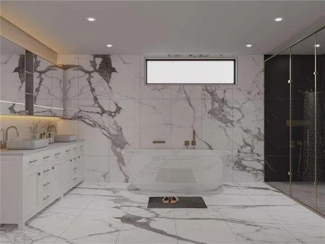 a bathroom with a bathtub and shower