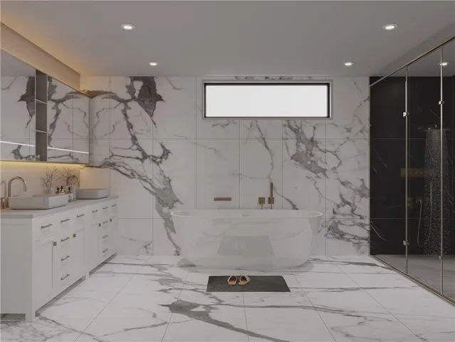 a bathroom with a bathtub and shower