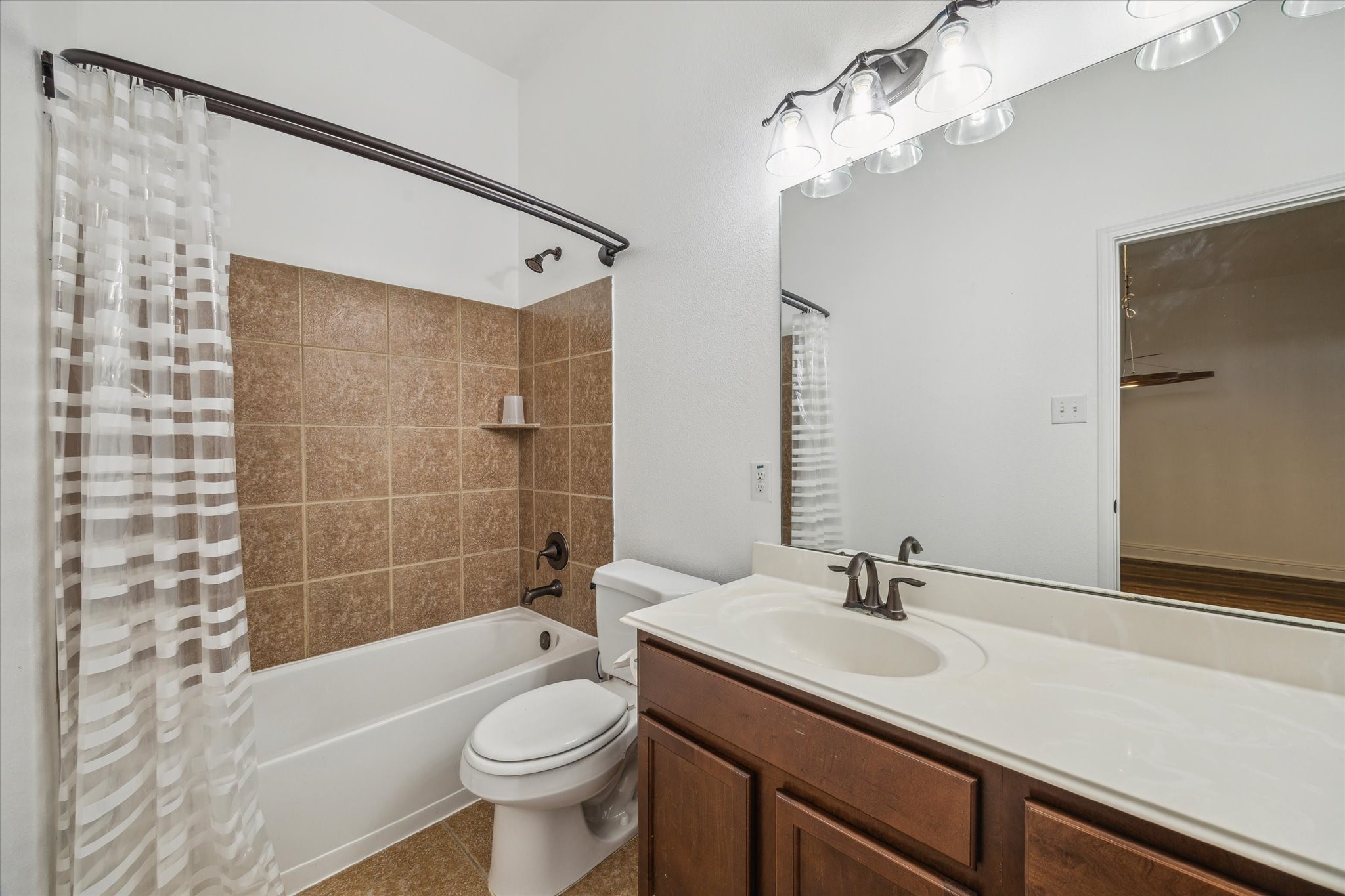 31 Butternut Grove Place Tomball, TX 77375 - Photo 17 of 25 a bathroom with a sink a toilet and shower