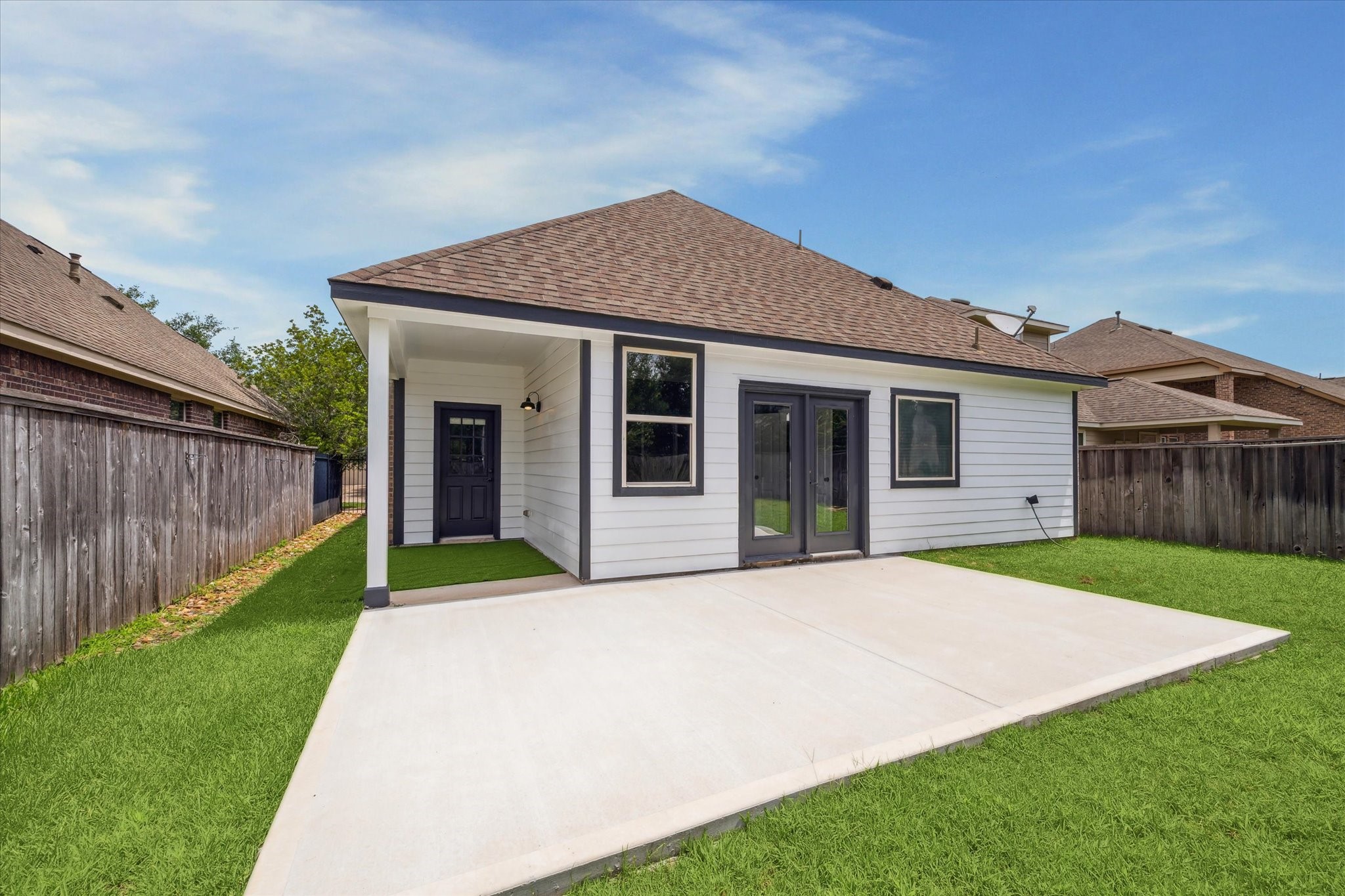 31 Butternut Grove Place Tomball, TX 77375 - Photo 20 of 25 a front view of a house with a yard and garage